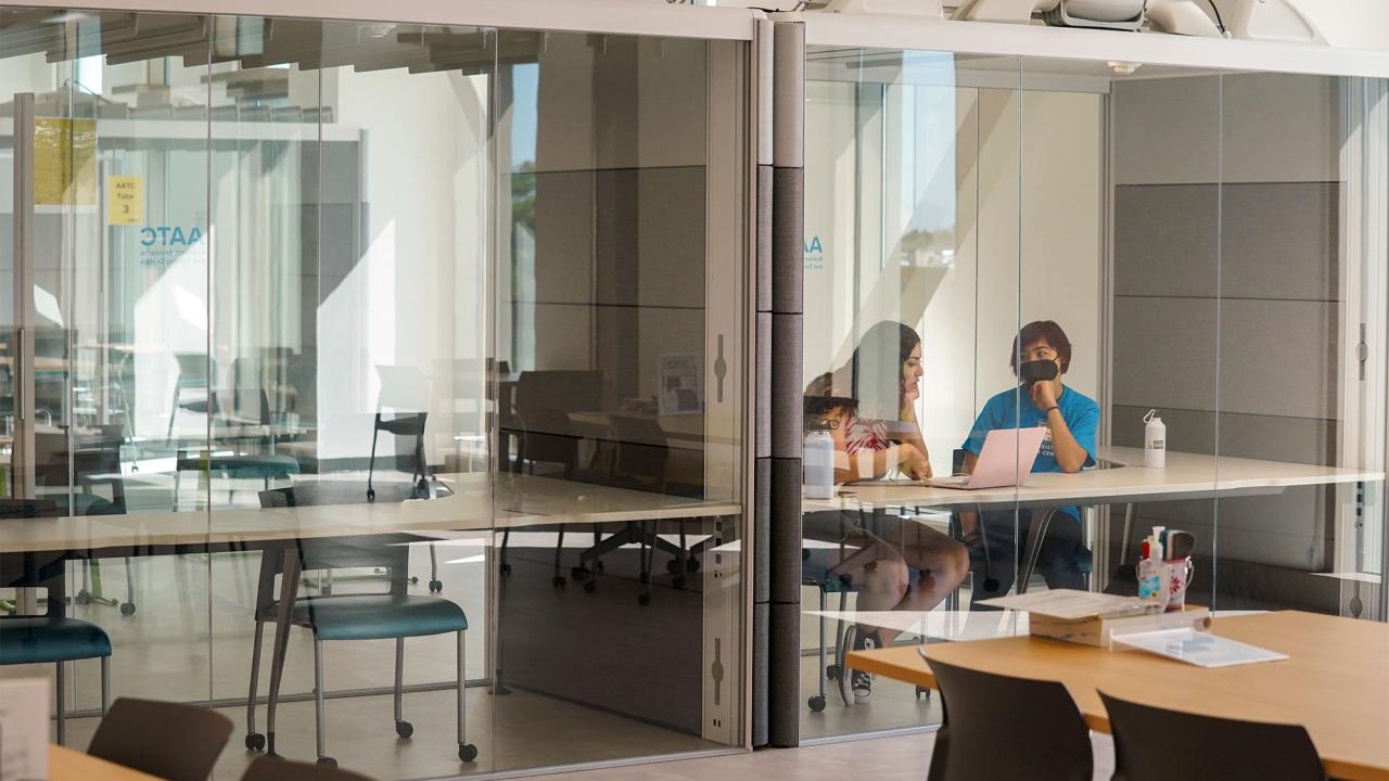 Students speak in glass pod