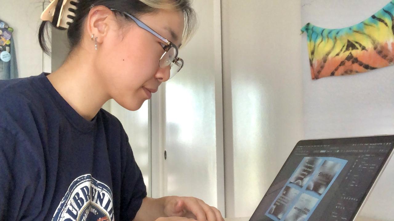 Lauren Hong at work at her virtual internship on her laptop. 