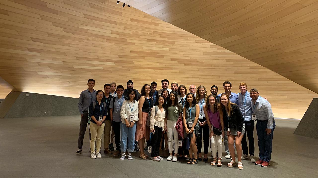 Students pose in a lobby on study abroad at UC Davis. 