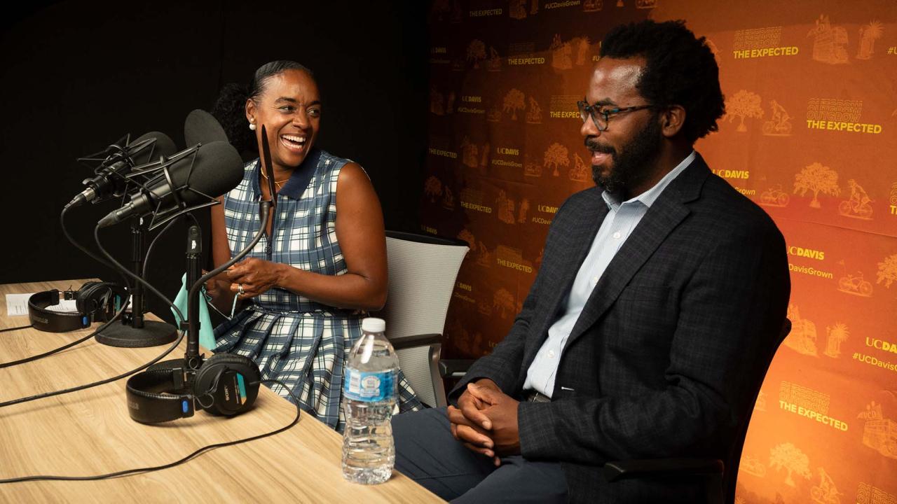 Maisha Winn and Torry Winn sit at table during interview.