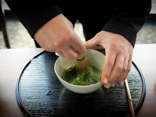 matcha green tea being mixed