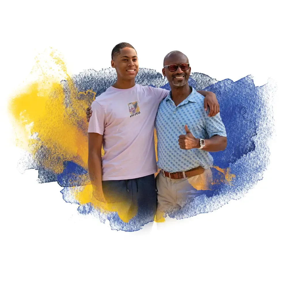 A father and son in front of a yellow and blue watercolor brush background