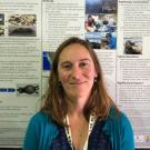 Megan Moriarty in front of her student research poster.