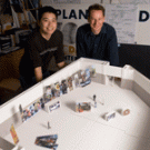 Design Program student Chris Wang, left, built this scale model of a Cal Expo pavilion to help with planning for the UC Davis Centennial exhibition to be housed in the pavilion during the state fair this summer. Also pictured is Assistant Profes