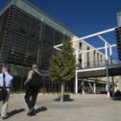 Students walk outside Maurice J. Gallagher Jr. Hall, the new home of the Graduate School of Management, on Oct. 5.