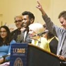 Sheri Atkinson, right, standing beside the staff of the Lesbian, Gay, Bisexual and Transgender Resource Center, tells the town hall audience in the ARC Ballroom the night of March 1: 'I'm really excited to see this place full: Don't mess with th
