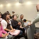 Sam Blanco talks with a family at Decision UC Davis