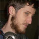 photo: man with headphones on neck