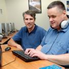 Photo: Tim Leamy, computer lab manager for Academic Technology Services, and Russ Zochowski, disability specialist at the Student Disability Center.