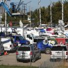 Photo: TV trucks, many with their satellite masts raised, filled the dirt lot that is kitty-corner from the Modavi Center for the Performing Arts.