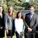 Photo: Six ELIPPS CA Fellows and the ELIPPS director, in a line, posed, in front of Mrak Hall