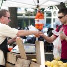 Photo: An East Quad Farmers Market vendor makes a sale.