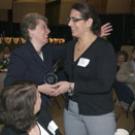 Claire Pomeroy, vice chancellor for human health sciences and dean of the School of Medicine, makes a presentation to Karen Charney, executive directo