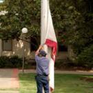 Joe Juarez of  Operations & Maintenance prepares to raise the California flag to half-staff Tuesday in memory of those killed in the Virginia Tech massacre. UC Davis joined other institutions nationwide in this act of remembrance, and will hold 