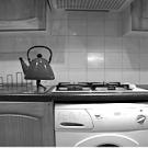 A frame from a Hiraki Sawa video shows a tea kettle with legs on his kitchen counter.