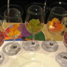 Heirloom tomatoes in wine glasses: brandywine, yellow brandywine, evergreen, marvel and cherokee purple.