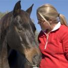 photo: woman talking to horse