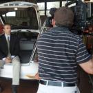 Professor Michael Kleeman sits in back of an alternative-fuel vehicle while being interviewed during a July 15 news conference.