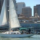 UC Davis' Kokua III sails past the San Francisco Ferry Building.