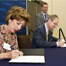 Photo: Chancellor Linda P.B. Katehi and LBNL Director Paul Alivisatos sign a memorandum of understanding for research collaboration.