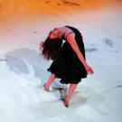 A dancer in Inbal Pinto's Shaker appears as if she were inside a snow globe.