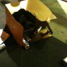 Cans of energy drink spill out after a bomb squad robot opened the box. The box came with a note attached, with this phrase: "Test Answers."