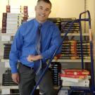 Photo: Jason Lorgan, associate director of the UC Davis Bookstore, and a sampling of the bookstore's rental textbooks