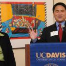 Louise Uota listens to accolades from Staff Assembly Chair Lin King, thanking Uota for her work as manager of the chancellor&rsquo;s residence.