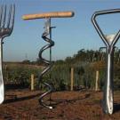 Photo: a giant-sized fork, corkscrew and bottle opener 
