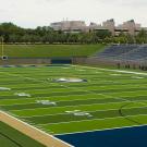 Photo: Empty football stadium with electronic scoreboard in the bacground