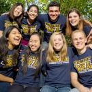 Group of students in two rows with We Are Aggie Pride! T-shirts