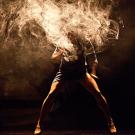 Stylized photo of a man that looks like his head and torso are burning.
