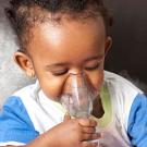 Photo: baby breathing into a device