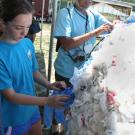 Photo: Seventh-grader Margo Wagner of Alexandria, Va., stuffs plastic bags into a wire-framed sphere, helping to create a globe of the Earth.