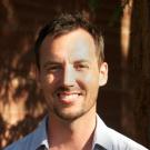 Photo: Professor Benjamin Houlton against backdrop of the bark of a redwood tree