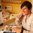 A woman with the Article 26 Backpack comic book