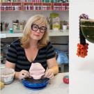 Combo: Kathy Butterly at work, in studio; flanked by two of her sculptures, "Color Hoard-r" and "Frill Seeker."