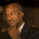 Chancellor May rest chin on hand.