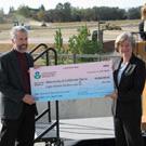 Engineering professor Tony Wexler, left, receives a big check from Deborah Jordan of the U.S. Environmental Protection Agency.