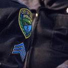 A badge and patch for the Davis Police Department.