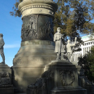 Massive memorial, with a soldier among the figures around the base