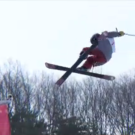 Screenshot of freeskier flying above halfpipe.