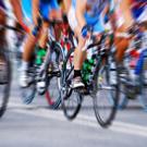 Photo of professional cyclists in a pack close up