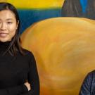 Xinyi &ldquo;Daisy&rdquo; He and Alexandra &ldquo;Alex&rdquo; San Pablo, in front of mural at Student Community Center