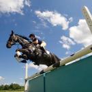 Woman jumping a horse