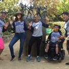 Facilitator and First-Year Aggie Connection students, striking fun poses around fun scultpture of little people in fun poses.