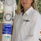 photo: woman holding large angled tube