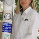 Kirsten Gilardi displays one of the recycling bins that are being installed at piers from Santa Cruz to the Mexican border, to give anglers a place to discard unwanted hooks and line.