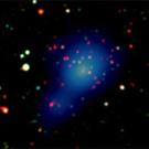 Photo: stars in dark sky, showing light-bulb shaped image in center