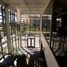 Photo: Inside view of windowed foyer at the new Gallagher Hall, home to the Graduate School of Business